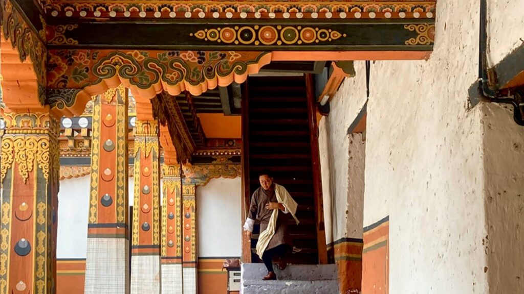 A man walking down stairs on Bhutan