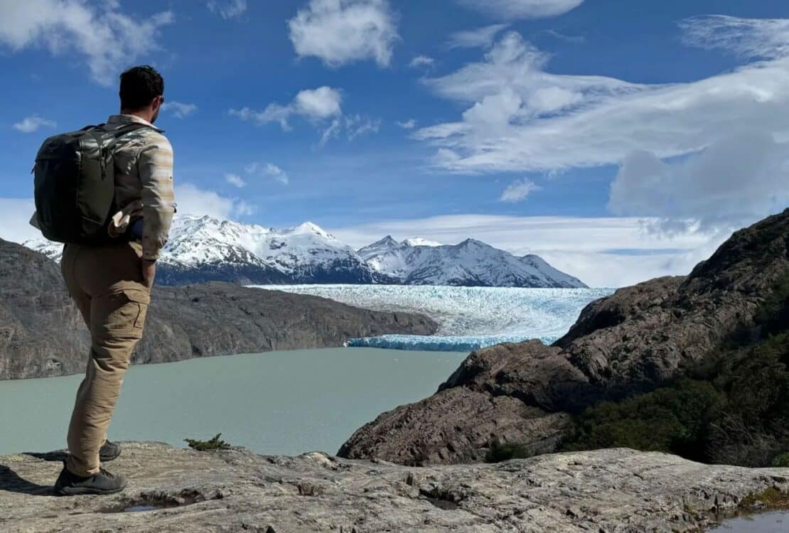 A backpacker looking at a view in Patagonia